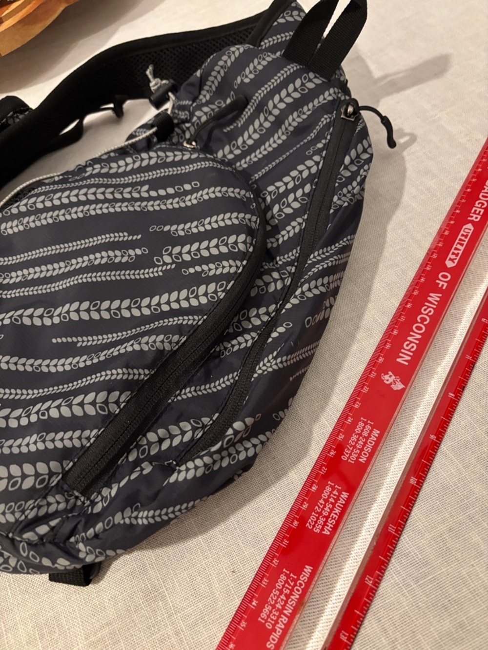 Eddie Bauer Black and Gray Patterned Sling Backpack - Picture 4 of 11